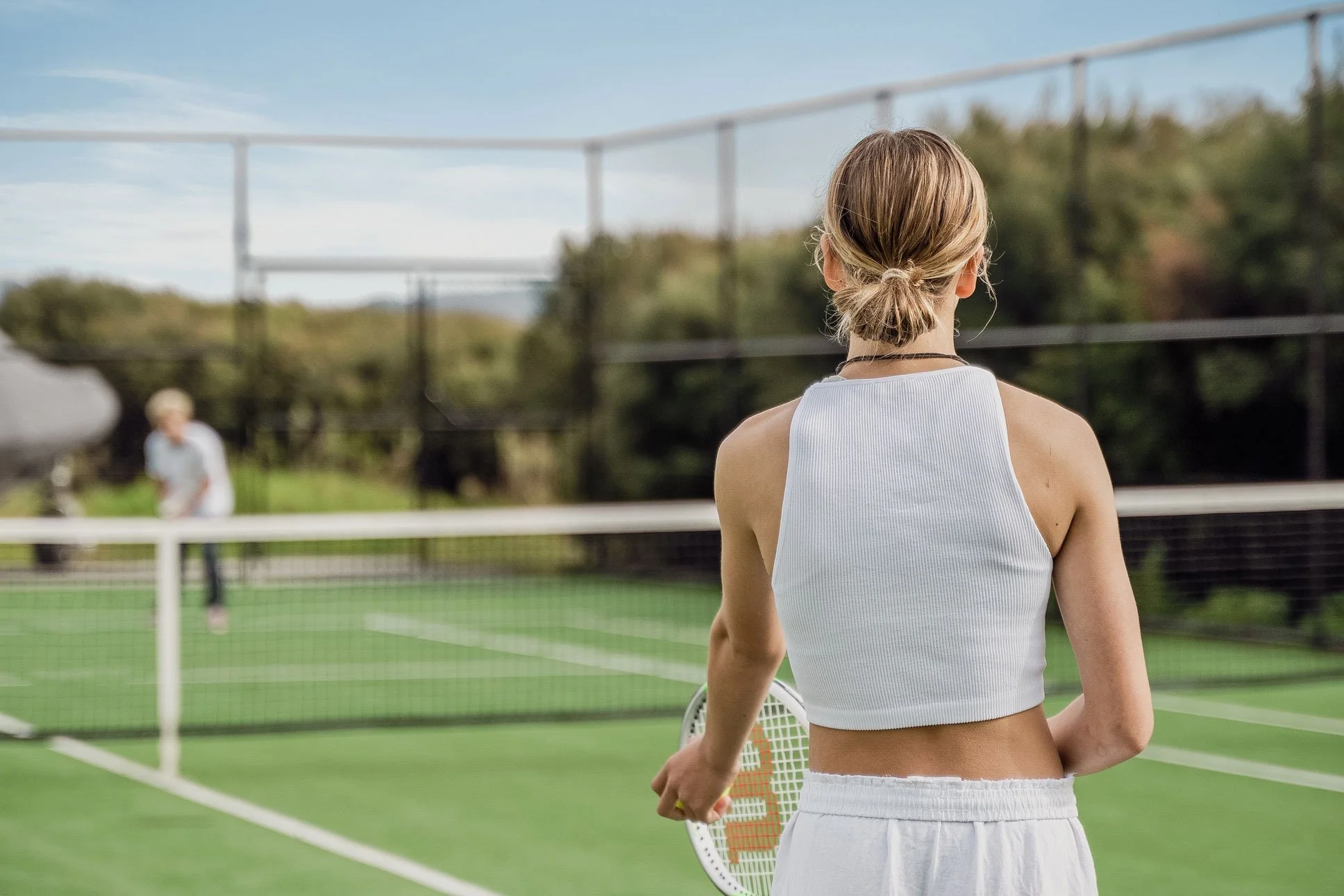 A rally on the tennis court at Bluestone Main Estate.